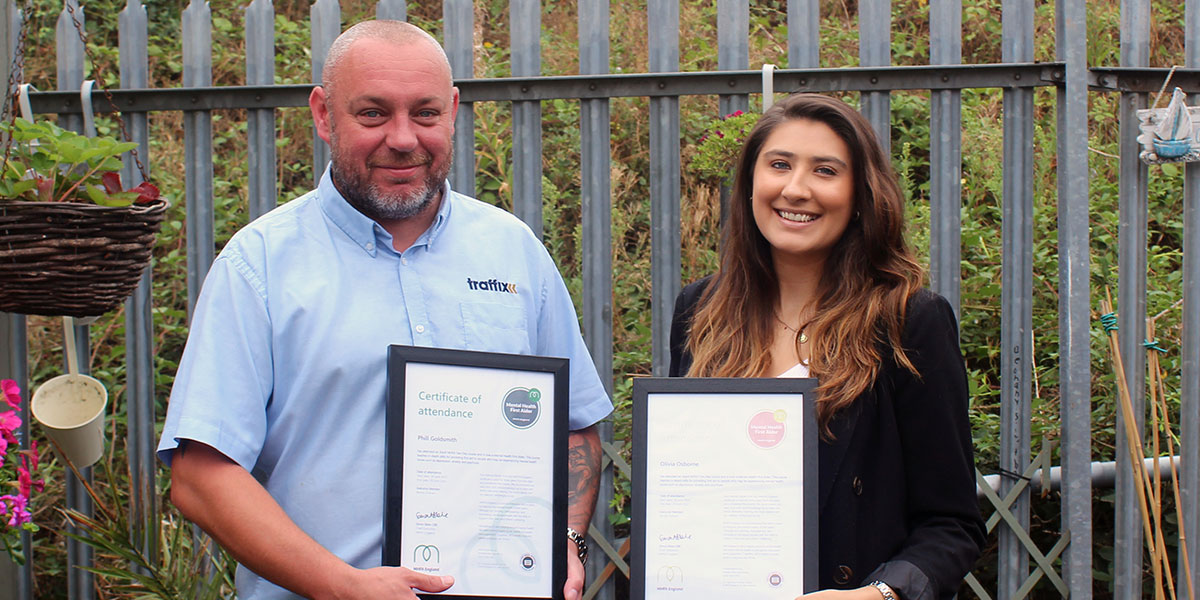 phil goldsmith and olivia osborne with their mental health first aid course certificates