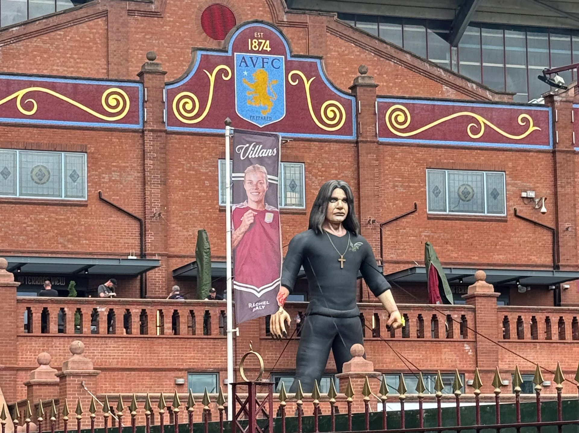 a statue of ozzy osbourne outside villa park